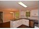 Well-lit kitchen with white cabinets, stainless steel appliances, and dark countertops, complemented by white subway tile backsplash at 26 Flint Ridge Se Dr, Mableton, GA 30126