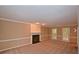 Spacious living room featuring a fireplace, neutral carpet, and access to the exterior at 26 Flint Ridge Se Dr, Mableton, GA 30126