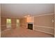 Comfortable living room with a fireplace, neutral carpet, and two windows at 26 Flint Ridge Se Dr, Mableton, GA 30126