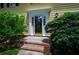 Inviting front entrance with a decorative door and lush landscaping at 4503 Rivercliff Sw Dr, Lilburn, GA 30047