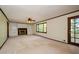 Living room with a fireplace and built-in shelving at 4503 Rivercliff Sw Dr, Lilburn, GA 30047