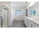 Main bathroom with double vanity and a shower at 179 Hampton Cir, Mcdonough, GA 30253