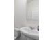 Simple bathroom with white sink, toilet, and mirror at 179 Hampton Cir, Mcdonough, GA 30253