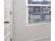Bright bedroom with window, blinds, and white door at 179 Hampton Cir, Mcdonough, GA 30253