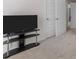 Bedroom with carpet, flat-screen TV, and doors leading to other rooms at 179 Hampton Cir, Mcdonough, GA 30253