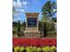 Hampton Preserve community entrance sign with red and yellow flowers at 179 Hampton Cir, Mcdonough, GA 30253