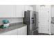 Kitchen area with stainless steel refrigerator and pantry at 179 Hampton Cir, Mcdonough, GA 30253