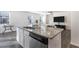 Modern kitchen island with granite countertop and stainless steel dishwasher at 179 Hampton Cir, Mcdonough, GA 30253