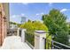 A spacious balcony with black metal railings overlooks lush greenery and cityscape views at 3707 Peachtree Ne Rd # 1, Atlanta, GA 30319