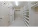 Walk-in closet with custom shelving and ample storage space at 3707 Peachtree Ne Rd # 1, Atlanta, GA 30319