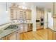 Butler's pantry featuring custom cabinets, granite counters, and stainless appliances at 3707 Peachtree Ne Rd # 1, Atlanta, GA 30319