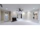 Spacious living room with a fireplace, ceiling fan, and plenty of natural light at 3707 Peachtree Ne Rd # 1, Atlanta, GA 30319