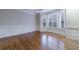 Bright living room featuring hardwood floors, bay windows, and elegant white trim at 3707 Peachtree Ne Rd # 1, Atlanta, GA 30319