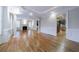 Large living room with hardwood floors, fireplace, and view to the kitchen at 3707 Peachtree Ne Rd # 1, Atlanta, GA 30319