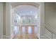 Elegant living room with hardwood floors, white trim, and arched doorways at 3707 Peachtree Ne Rd # 1, Atlanta, GA 30319