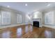 Bright living room with hardwood floors, a fireplace, and plantation shutters on the windows at 3707 Peachtree Ne Rd # 1, Atlanta, GA 30319