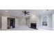 Open living room featuring a fireplace, ceiling fan, and natural light at 3707 Peachtree Ne Rd # 1, Atlanta, GA 30319