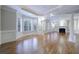 Spacious living room with hardwood floors, fireplace, and large windows at 3707 Peachtree Ne Rd # 1, Atlanta, GA 30319