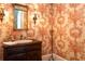 Charming powder room featuring floral wallpaper and antique-style fixtures at 3707 Peachtree Ne Rd # 1, Atlanta, GA 30319