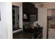 Kitchen featuring dark cabinetry, tile backsplash, and stainless steel appliances at 2697 Vinings Central Dr # 61, Atlanta, GA 30339