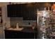 Kitchen with dark cabinets, tile backsplash, stainless steel appliances and decorated refrigerator at 2697 Vinings Central Dr # 61, Atlanta, GA 30339
