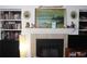 Cozy living room featuring a fireplace with decorative mantel and built-in bookshelves at 2697 Vinings Central Dr # 61, Atlanta, GA 30339