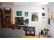 View of a living room featuring a large bookshelf, artwork and hardwood floors at 2697 Vinings Central Dr # 61, Atlanta, GA 30339