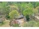 Aerial view of a single-Gathering home surrounded by lush trees, showcasing the natural beauty of the area at 798 Tommy Lee Cook Rd, Palmetto, GA 30268