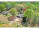 Aerial view shows the property with a shed and neighbor's home with a wooded backdrop at 798 Tommy Lee Cook Rd, Palmetto, GA 30268
