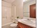 Cozy bathroom with vanity, toilet, mirror and combined tub and shower at 798 Tommy Lee Cook Rd, Palmetto, GA 30268