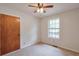 Bedroom featuring a window with natural light, a ceiling fan, and neutral carpet at 798 Tommy Lee Cook Rd, Palmetto, GA 30268