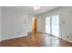 A bright, well-lit bedroom with a ceiling fan and sliding door to the outside at 798 Tommy Lee Cook Rd, Palmetto, GA 30268