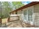 Wooden deck showcasing french doors with glass panes, wood railings and wooden stairs at 798 Tommy Lee Cook Rd, Palmetto, GA 30268