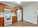 Cozy kitchen featuring wood cabinets, white countertops, and a spacious layout at 798 Tommy Lee Cook Rd, Palmetto, GA 30268