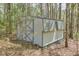 A backyard shed offers extra storage in a wooded area, a great addition to the property at 798 Tommy Lee Cook Rd, Palmetto, GA 30268