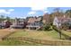 Beautiful backyard featuring a well-maintained lawn, black metal fencing, and a patio perfect for entertaining at 8150 Albritton Downs, Cumming, GA 30041