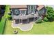 An expansive backyard featuring a multilevel deck, patio, fire pit, and lush green lawn perfect for outdoor entertaining at 8150 Albritton Downs, Cumming, GA 30041