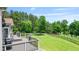 Enjoy the backyard with a lovely deck, lush grass and view of the golf course at 8150 Albritton Downs, Cumming, GA 30041