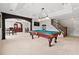 Finished basement with pool table, bar area, and stairs at 8150 Albritton Downs, Cumming, GA 30041