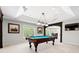 Finished basement features a billiards table, recessed lighting, and great entertaining space at 8150 Albritton Downs, Cumming, GA 30041