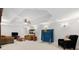 Open basement with living area, ping pong table, plush seating and ambient lighting at 8150 Albritton Downs, Cumming, GA 30041