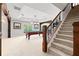 Spacious finished basement with billiards table, stairs and decorative architectural elements at 8150 Albritton Downs, Cumming, GA 30041