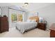 Comfortable bedroom with large window, sloped ceiling, and classic furniture pieces at 8150 Albritton Downs, Cumming, GA 30041