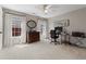 Bedroom with neutral tones, two large windows, and home office setup; perfect for work or study at 8150 Albritton Downs, Cumming, GA 30041