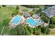 Aerial view of community pool area with multiple pools and lounge chairs, ideal for relaxation and recreation at 8150 Albritton Downs, Cumming, GA 30041
