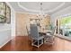 Elegant dining room with a modern chandelier, stylish decor, and plenty of natural light at 8150 Albritton Downs, Cumming, GA 30041