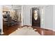 Grand foyer with hardwood floors, a striking chandelier, and a view into the dining area, creating a welcoming entrance at 8150 Albritton Downs, Cumming, GA 30041