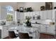 Kitchen with white cabinets, stainless steel appliances, granite countertops, and an island at 8150 Albritton Downs, Cumming, GA 30041