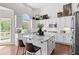 Modern kitchen with granite countertops, stainless steel appliances, and center island at 8150 Albritton Downs, Cumming, GA 30041