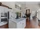 Gourmet kitchen with an island, stainless steel appliances, and modern finishes at 8150 Albritton Downs, Cumming, GA 30041